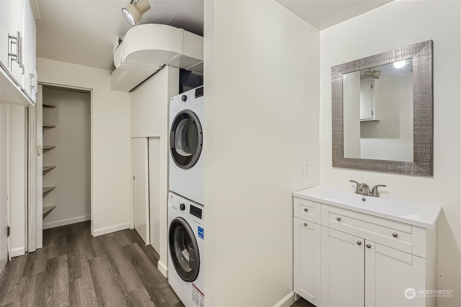 8536 Nesbit Avenue North, Unit A Seattle, WA 98103 - Photo 12 of 32 a bathroom with a sink and a mirror