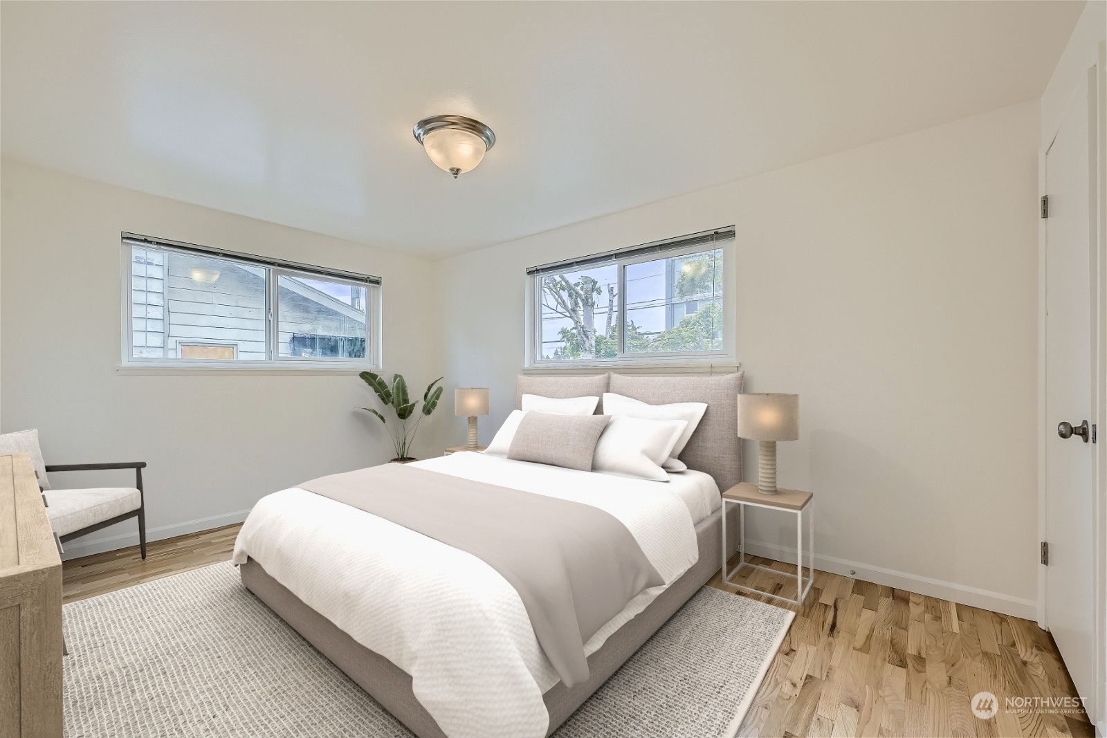 8536 Nesbit Avenue North, Unit A Seattle, WA 98103 - Photo 15 of 32 a bedroom with a bed and a window