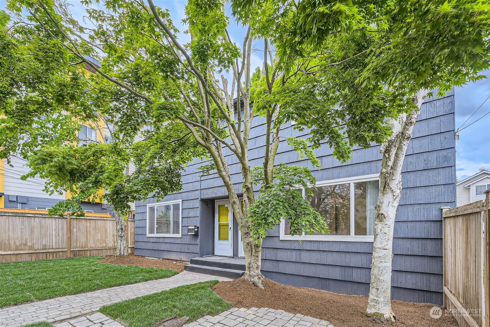 8536 Nesbit Avenue North, Unit A Seattle, WA 98103 - Photo 2 of 32 a view of house with a yard