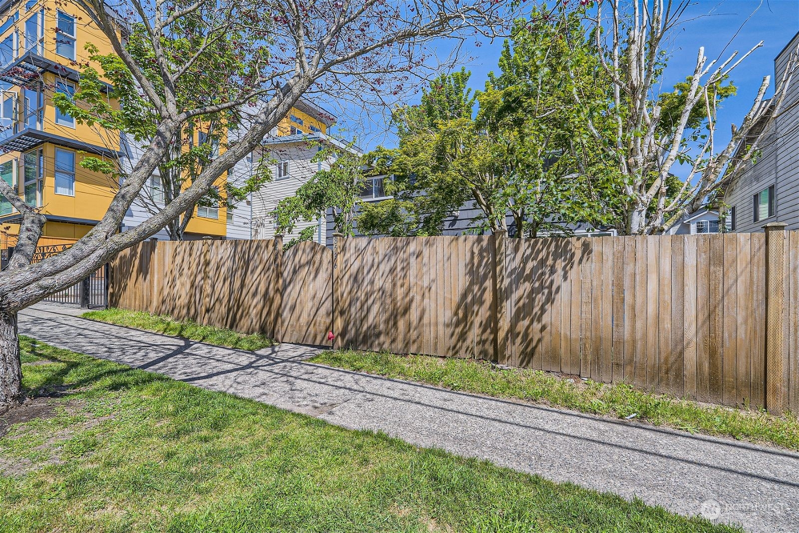 8536 Nesbit Avenue North, Unit A Seattle, WA 98103 - Photo 24 of 32 a view of garden with a wooden fence