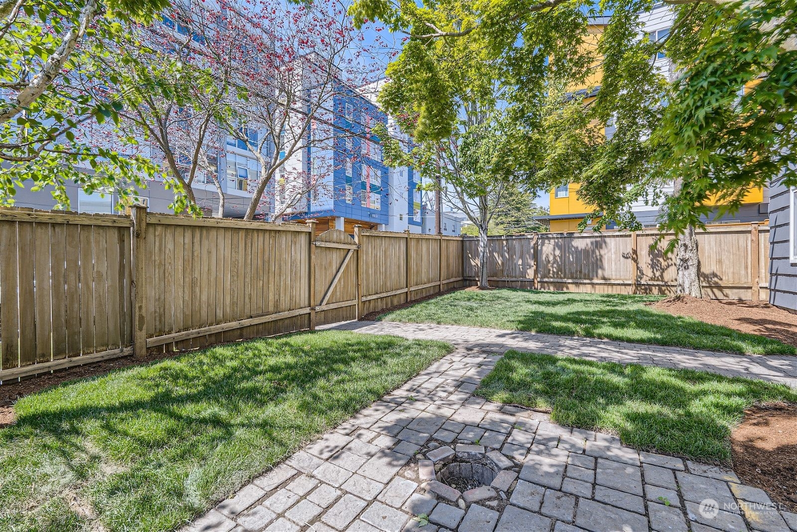8536 Nesbit Avenue North, Unit A Seattle, WA 98103 - Photo 28 of 32 a view of backyard with wooden fence