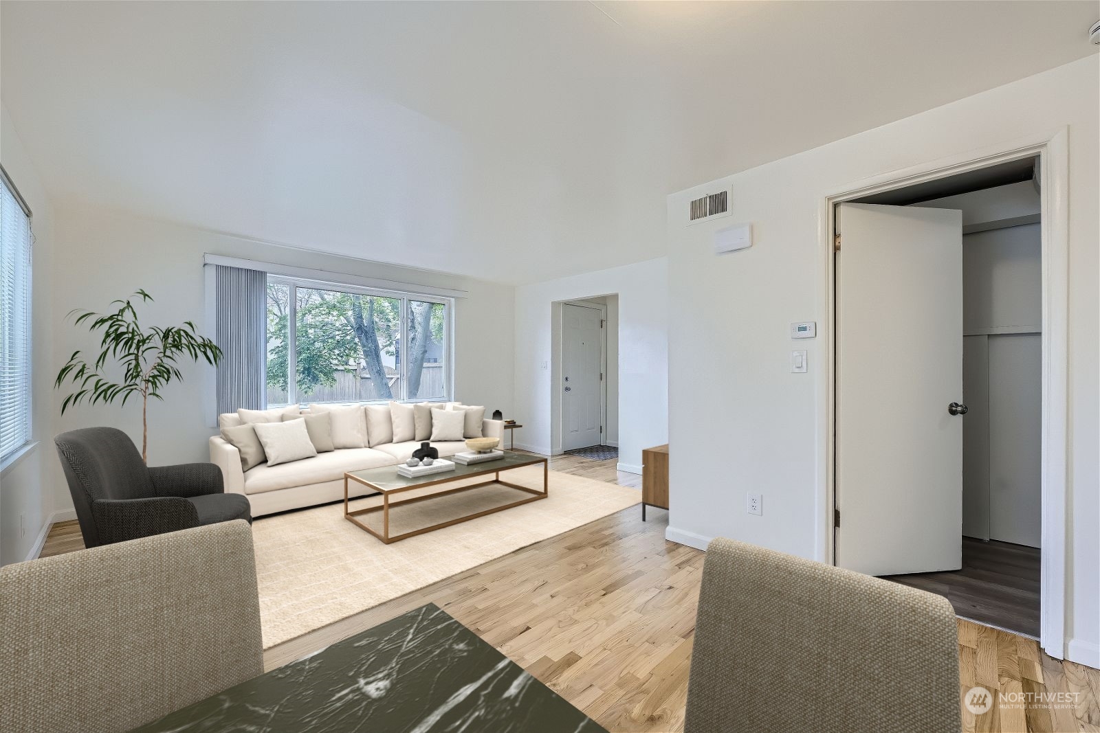 8536 Nesbit Avenue North, Unit A Seattle, WA 98103 - Photo 4 of 32 a living room with furniture and a large window