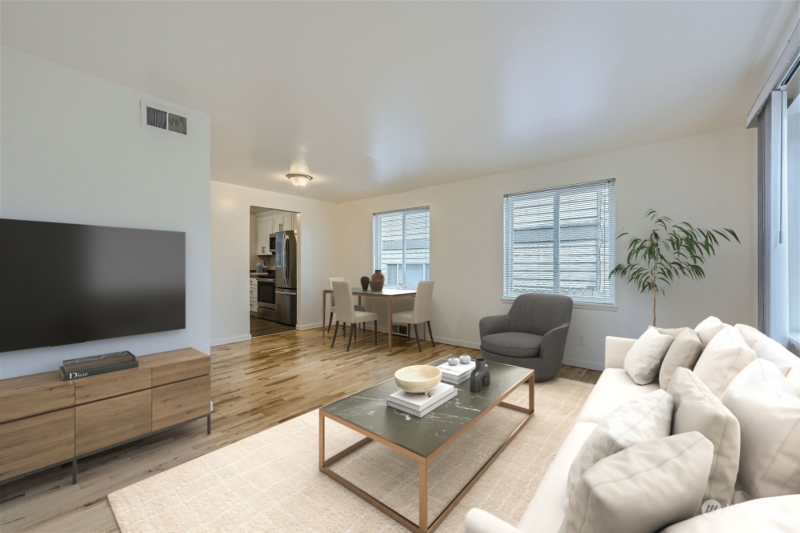 8536 Nesbit Avenue North, Unit A Seattle, WA 98103 - Photo 5 of 32 a living room with furniture and a flat screen tv