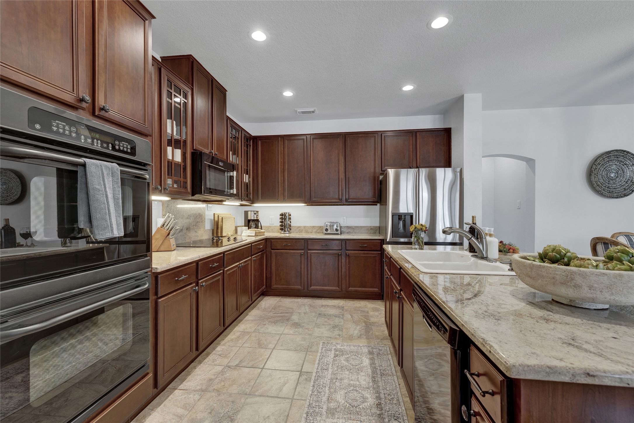 157 Kurt Kramer Road Fredericksburg, TX 78624 - Photo 9 of 38 The kitchen is equipped with built-in appliances and double ovens for a seamless cooking experience.