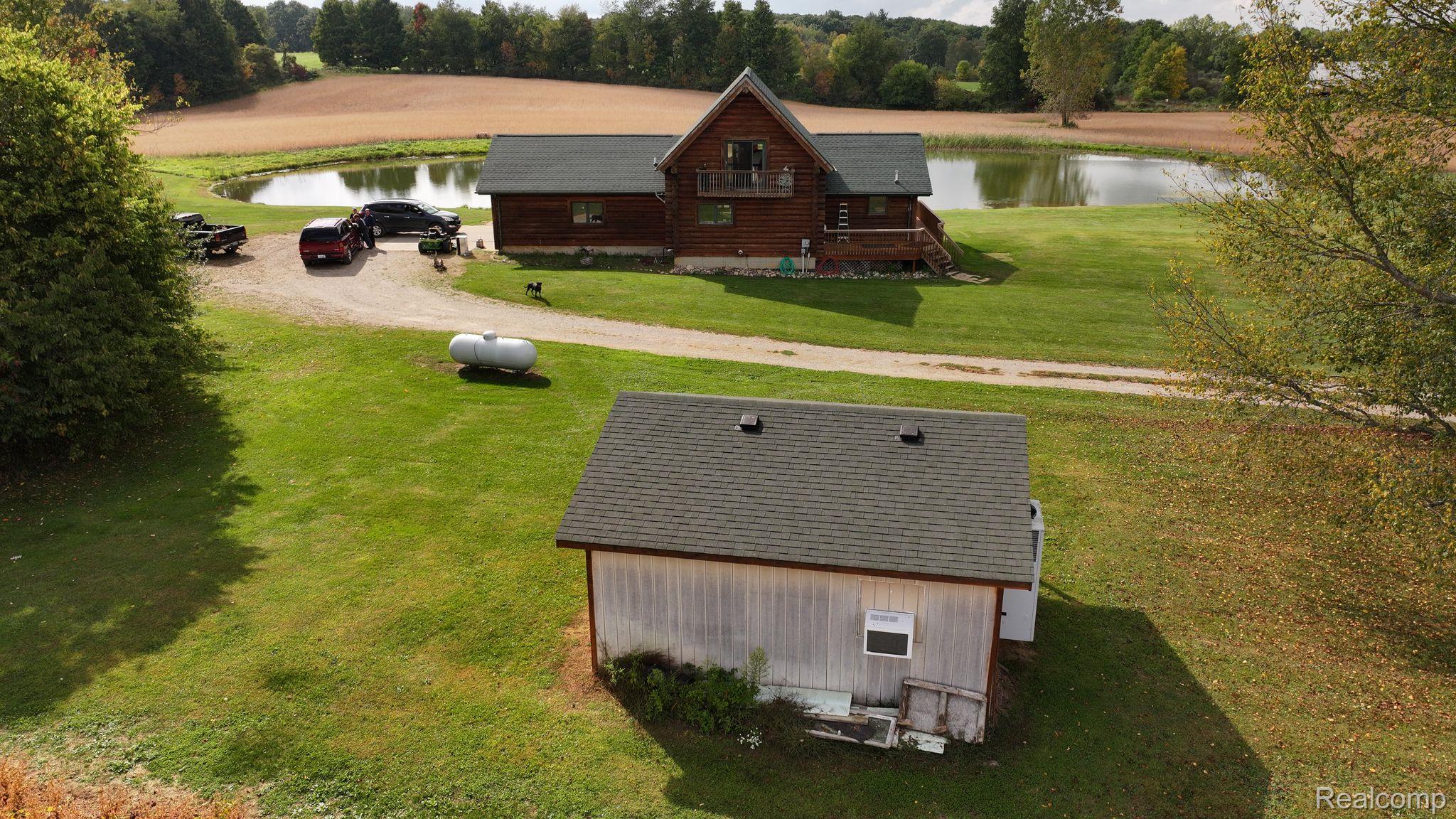 10374 Wilson Road Otisville, MI 48463 - Photo 95 of 99 Aerial view of property and surrounding area with a large body of water