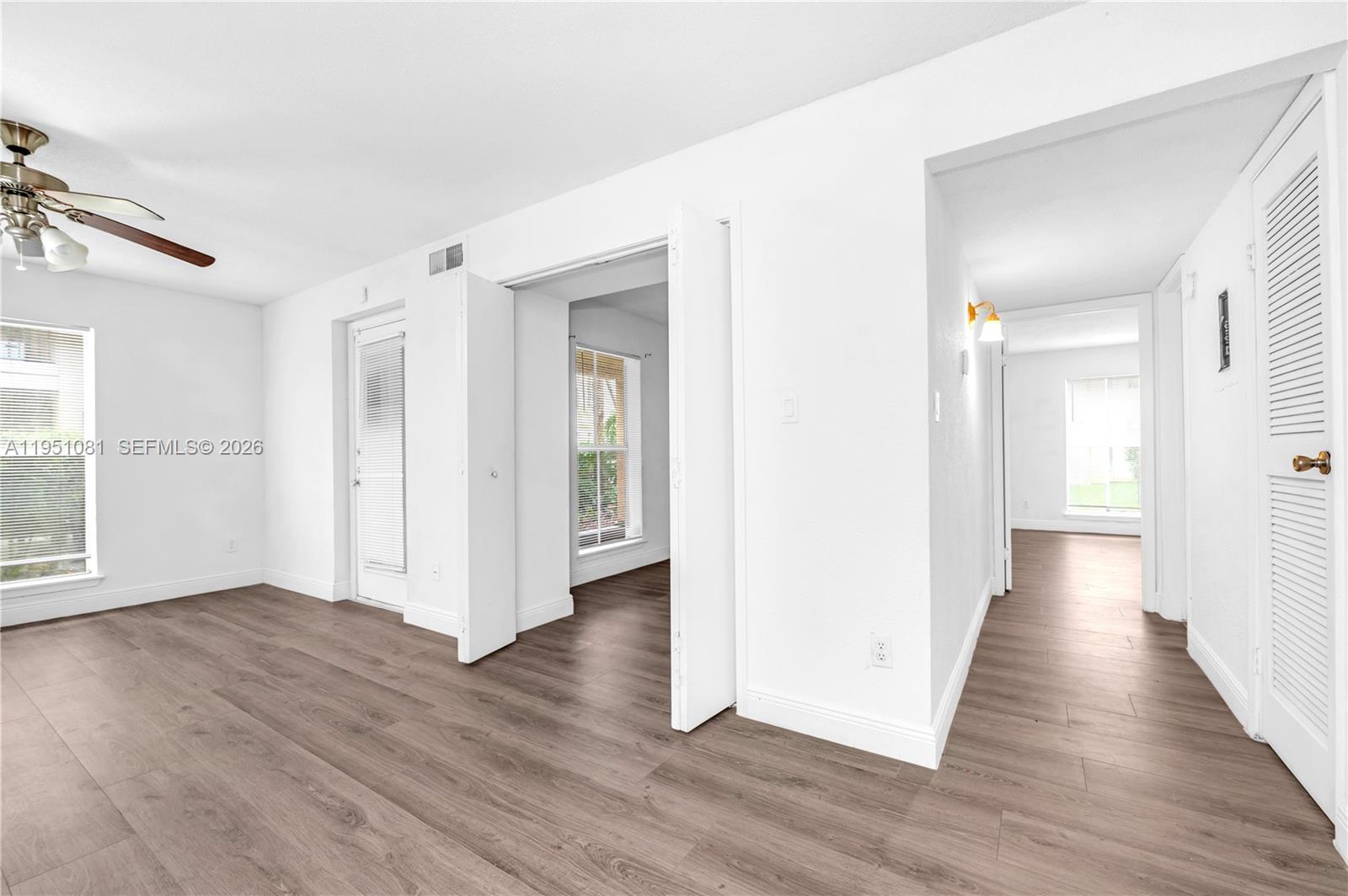 833 Riverside Drive, Unit 811 Coral Springs, FL 33071 - Photo 15 of 26 a view of a hallway with wooden floor