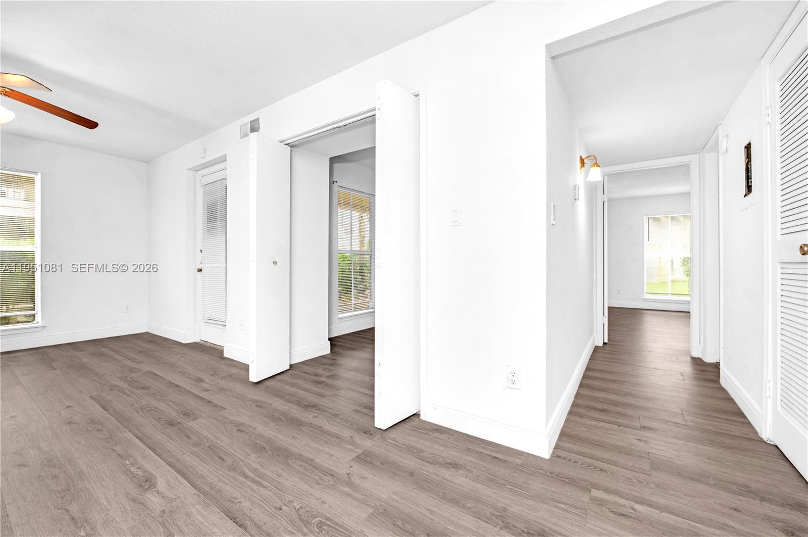 833 Riverside Drive, Unit 811 Coral Springs, FL 33071 - Photo 16 of 26 a view of a hallway with wooden floor