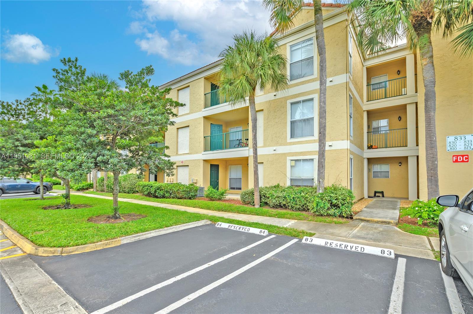 833 Riverside Drive, Unit 811 Coral Springs, FL 33071 - Photo 19 of 26 a view of a building with a yard