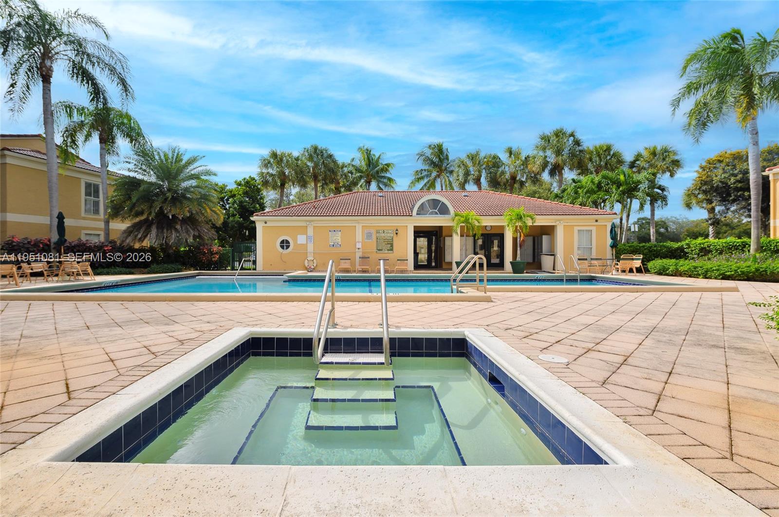833 Riverside Drive, Unit 811 Coral Springs, FL 33071 - Photo 25 of 26 a view of a patio with swimming pool