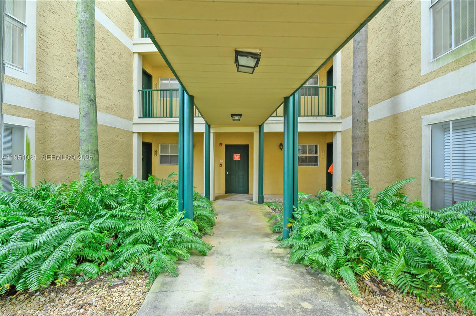 833 Riverside Drive, Unit 811 Coral Springs, FL 33071 - Photo 26 of 26 a view of an entryway of the house with potted plants