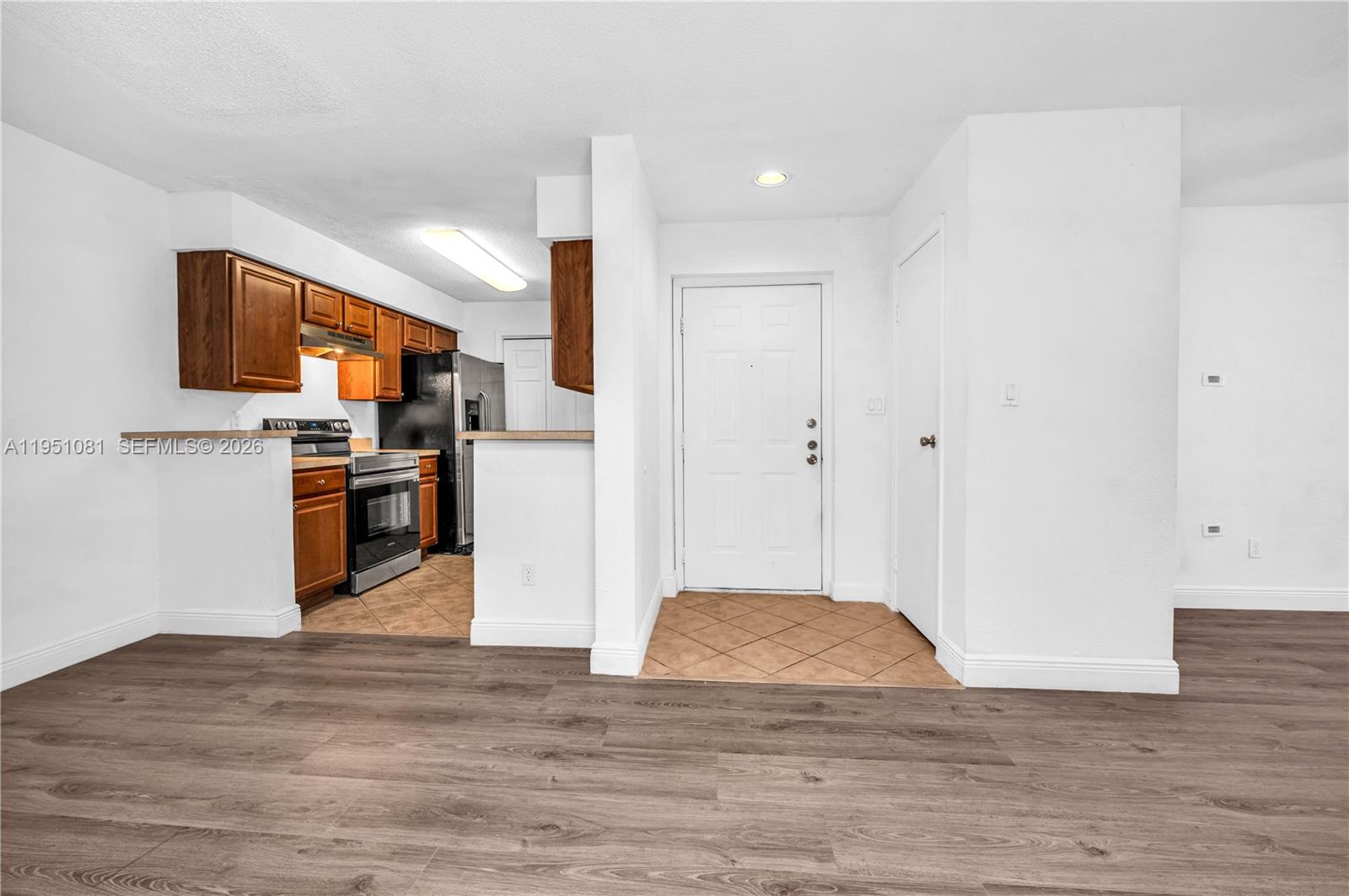 833 Riverside Drive, Unit 811 Coral Springs, FL 33071 - Photo 4 of 26 a view of kitchen view wooden floor and electronic appliances