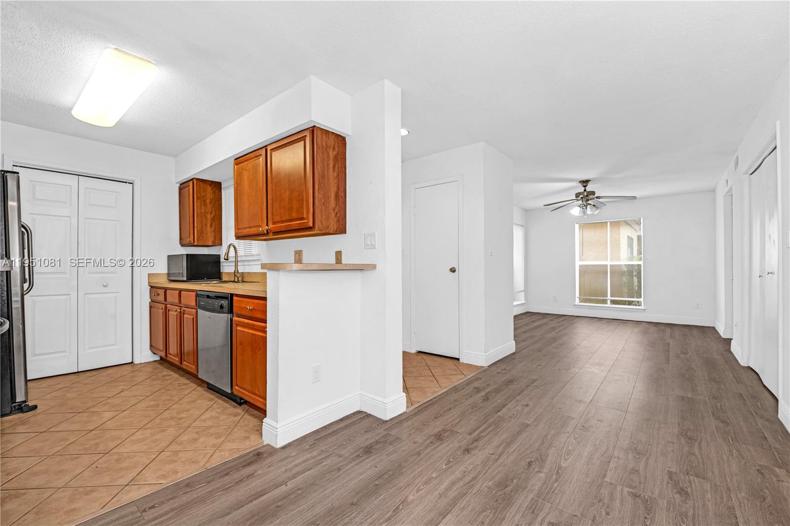 833 Riverside Drive, Unit 811 Coral Springs, FL 33071 - Photo 7 of 26 a view of kitchen with sink and wooden floor