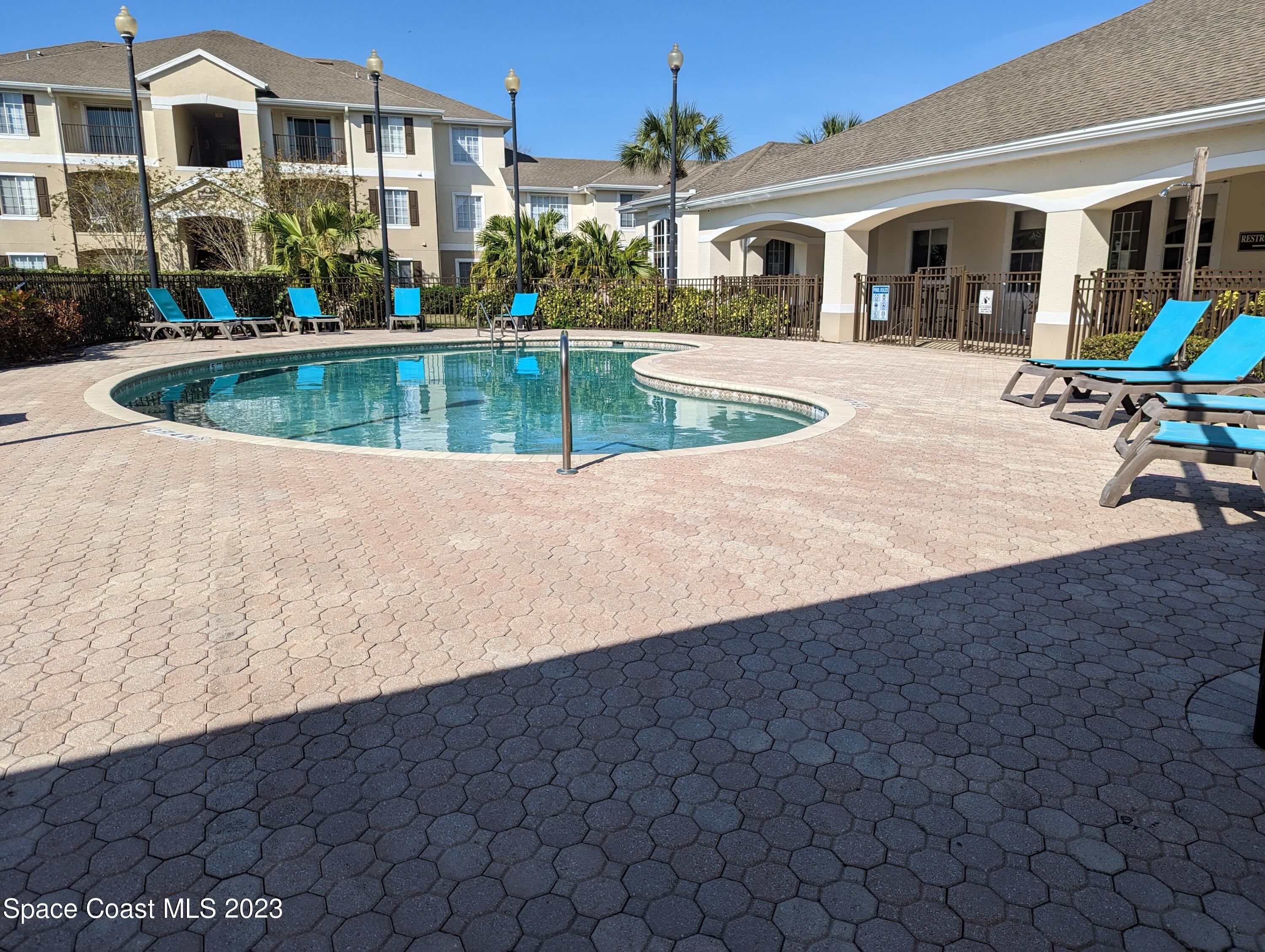 3511 D'Avinci Way, Unit 2012 Melbourne, FL 32901 - Photo 19 of 22 a front view of a house with swimming pool