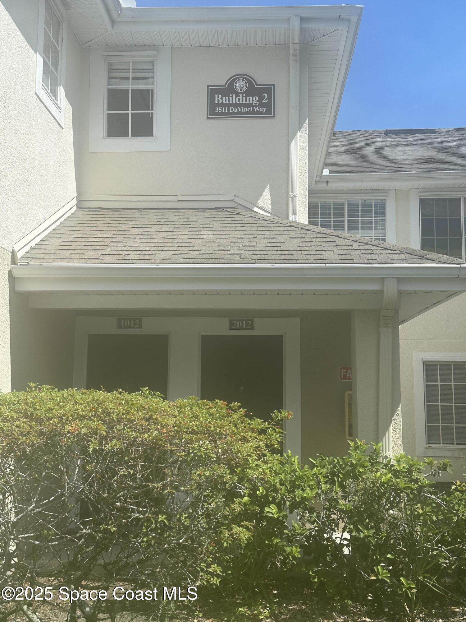 3511 D'Avinci Way, Unit 2012 Melbourne, FL 32901 - Photo 2 of 22 a view of a house with a garage