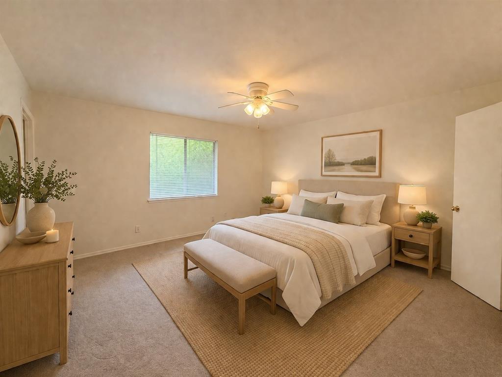 504 Woodcrest Way Forney, TX 75126 - Photo 12 of 26 a bedroom with a bed and a potted plant