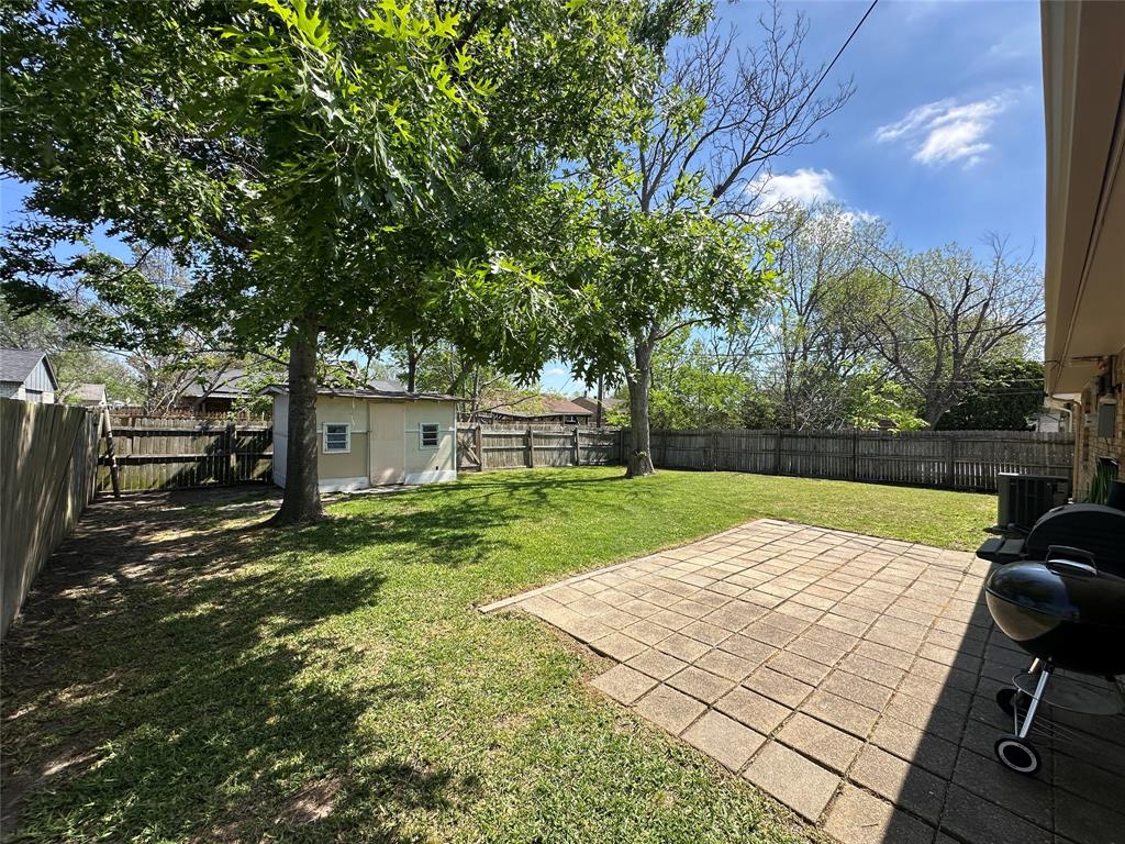 504 Woodcrest Way Forney, TX 75126 - Photo 2 of 26 a view of backyard with seating space
