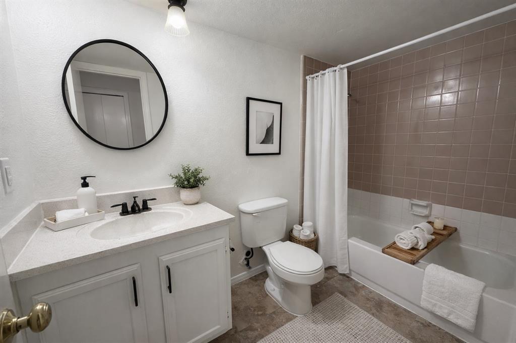 504 Woodcrest Way Forney, TX 75126 - Photo 22 of 26 a bathroom with a toilet sink and mirror