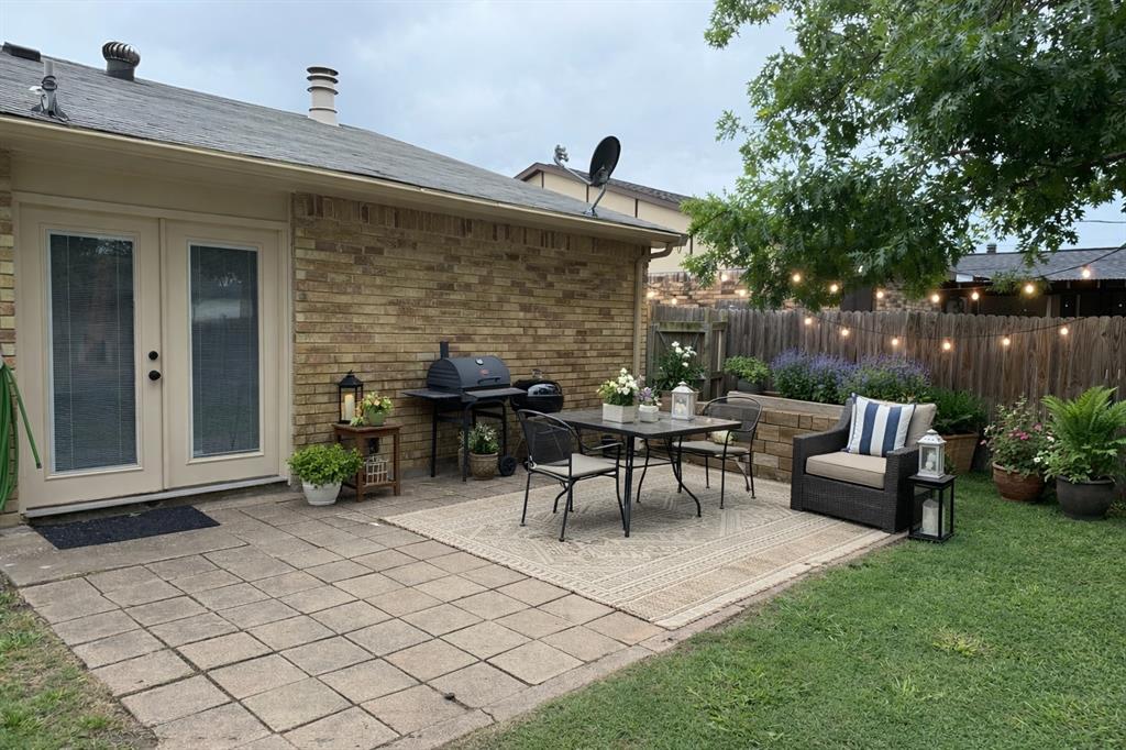 504 Woodcrest Way Forney, TX 75126 - Photo 24 of 26 a view of a patio with table and chairs with a barbeque grill and plants