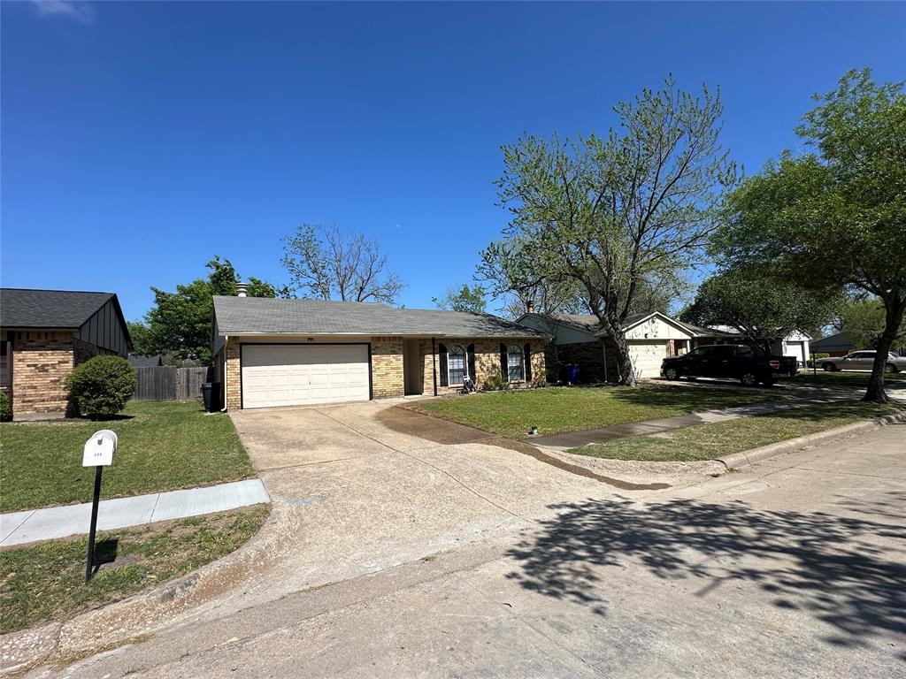 504 Woodcrest Way Forney, TX 75126 - Photo 25 of 26 a front view of a house with a yard