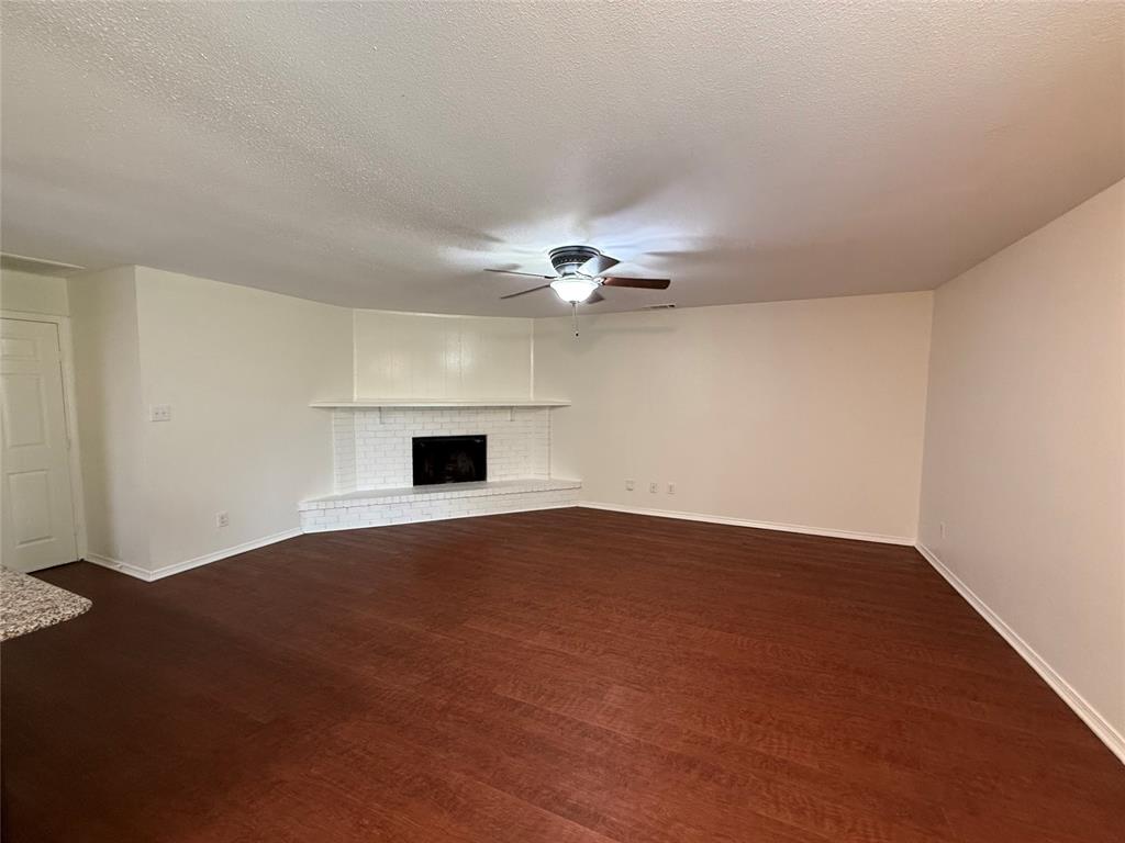 504 Woodcrest Way Forney, TX 75126 - Photo 9 of 26 a view of an empty room with a chandelier fan