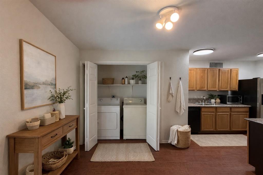 504 Woodcrest Way Forney, TX 75126 - Photo 10 of 26 a view of a kitchen with a sink stove and cabinets