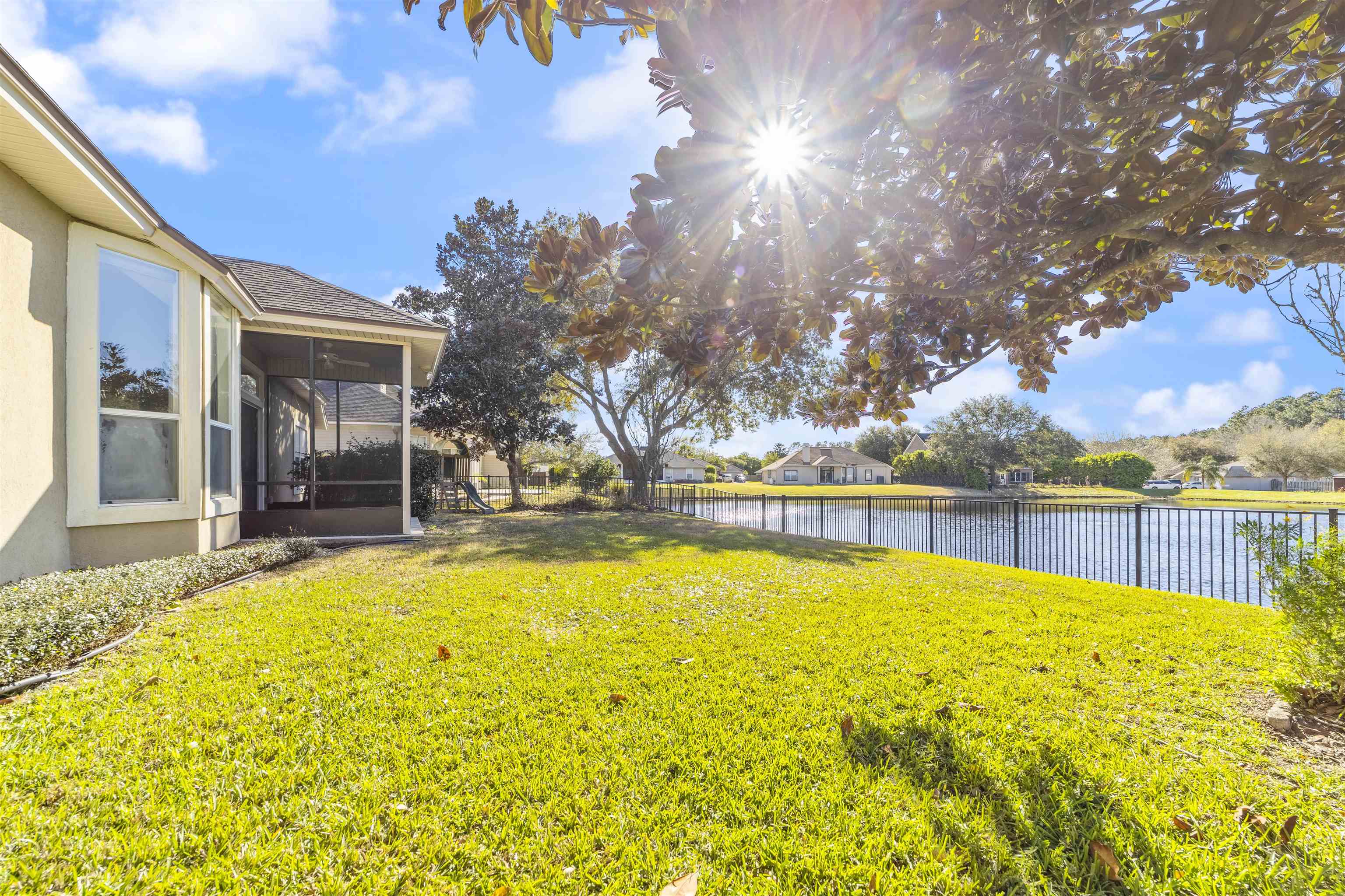 145 Whisper Ridge Drive St. Augustine, FL 32092 - Photo 2 of 32 a view of swimming pool with outdoor seating and yard in the back