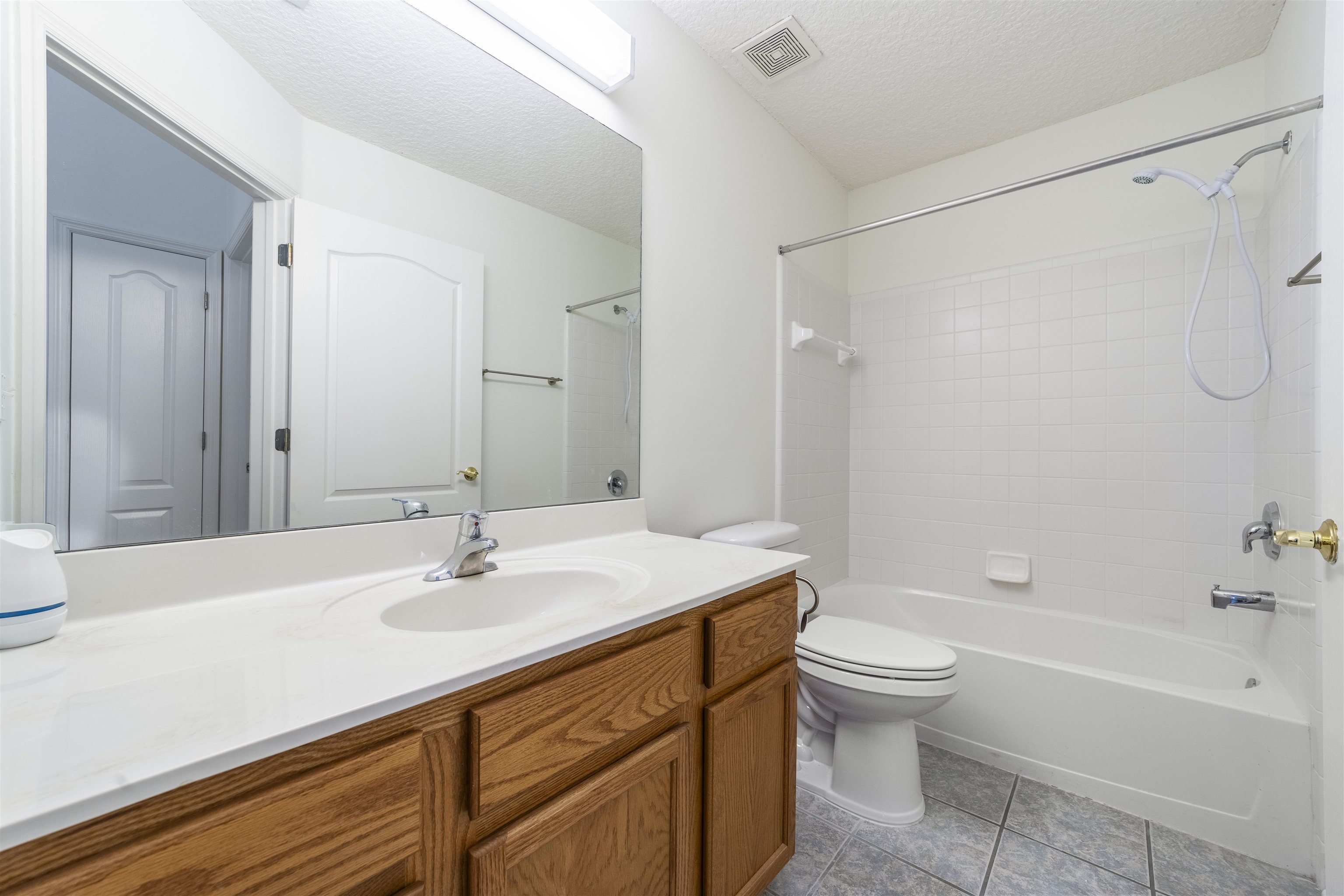 145 Whisper Ridge Drive St. Augustine, FL 32092 - Photo 26 of 32 a bathroom with a sink toilet tub and shower