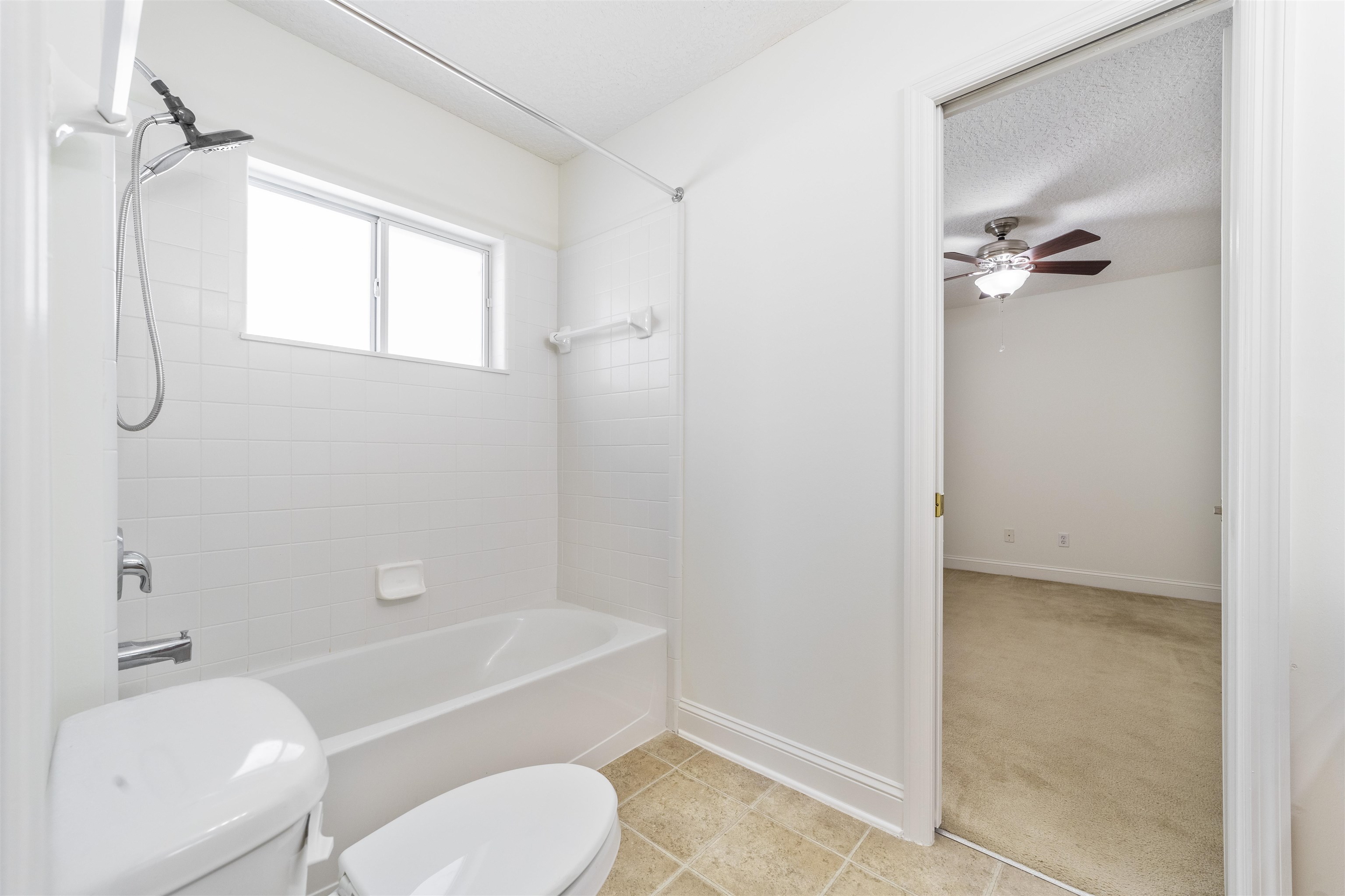 145 Whisper Ridge Drive St. Augustine, FL 32092 - Photo 29 of 32 a bathroom with a granite countertop bathtub shower sink vanity and a toilet