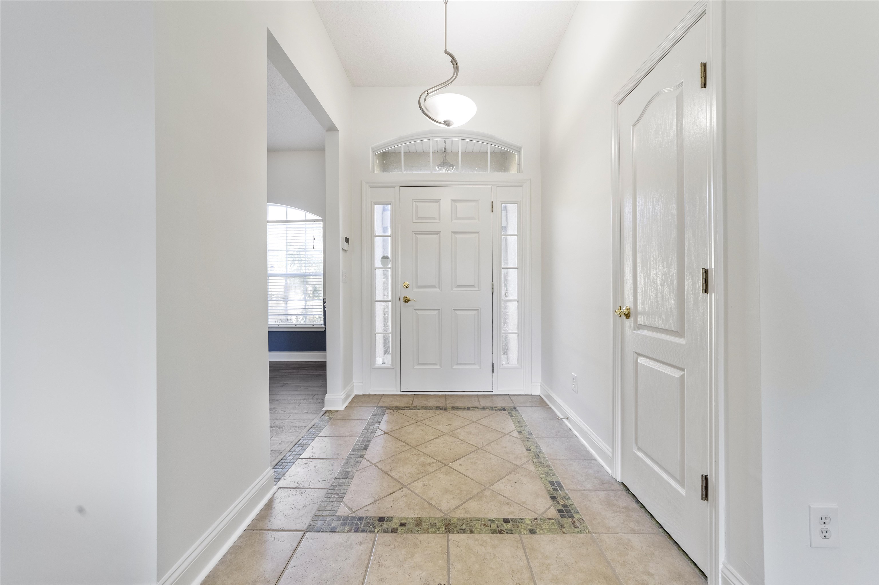 145 Whisper Ridge Drive St. Augustine, FL 32092 - Photo 8 of 32 a view of a hallway with shower and windows