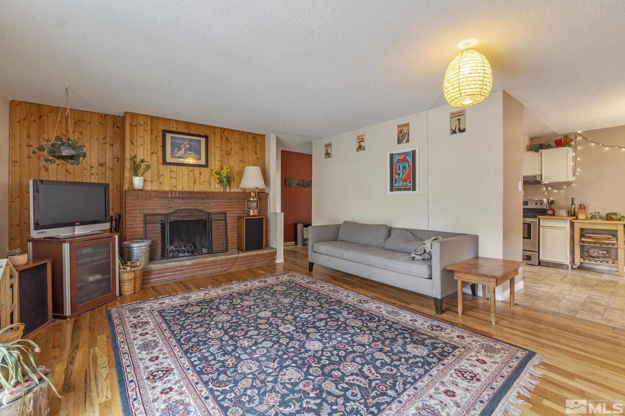 1480 Rayburn Drive Reno, NV 89503 - Photo 2 of 29 a living room with furniture and a fireplace