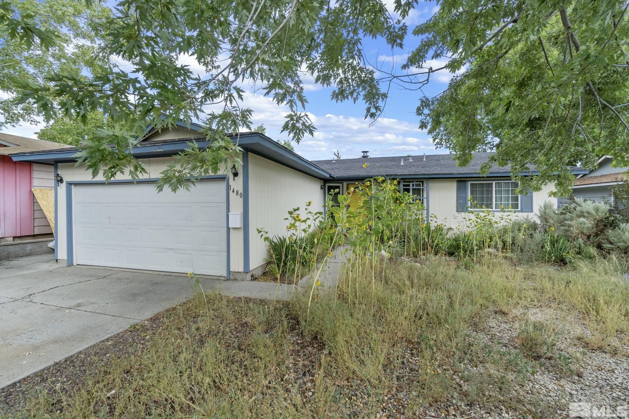 1480 Rayburn Drive Reno, NV 89503 - Photo 28 of 29 a front view of a house with garden