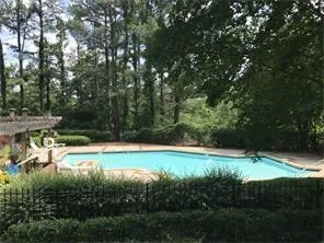 a kitchen with sink cabinets and granite counter top