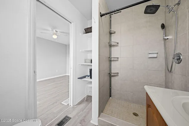 a bathroom with a shower and a sink