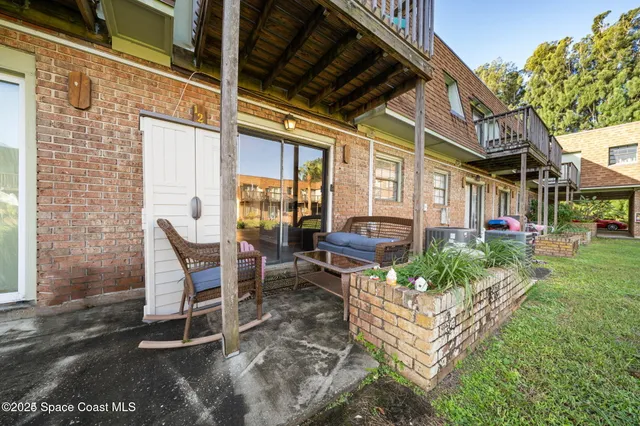 a view of a building with a yard
