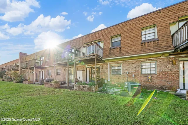 a view of a building with a yard