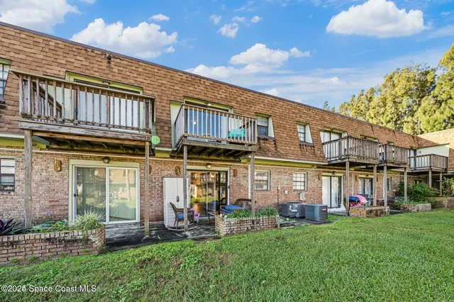a view of a car park in front of building