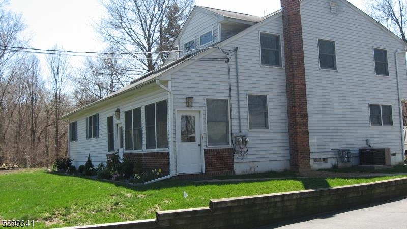 206 Ryerson Road Lincoln Park, NJ 07035 - Photo 2 of 23 a view of a house with a yard and a large tree