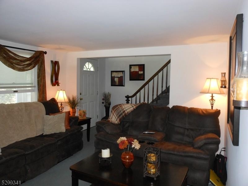 206 Ryerson Road Lincoln Park, NJ 07035 - Photo 6 of 23 a living room with furniture flowerpot and a fireplace