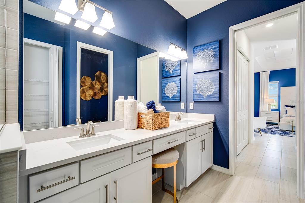 7165 Inlet Isles Lakewood Ranch, FL 34202 - Photo 20 of 26 a bathroom with a sink double vanity and a mirror