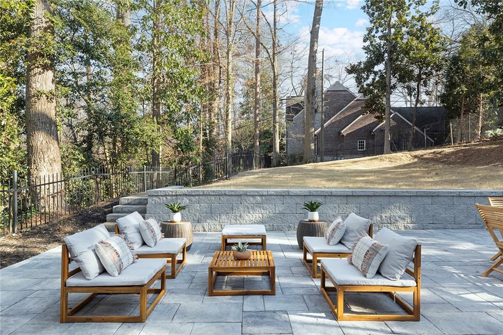 1275 The By Way Northeast Atlanta, GA 30306 - Photo 40 of 48 a roof deck with couches and wooden fence