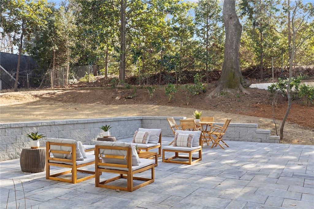 1275 The By Way Northeast Atlanta, GA 30306 - Photo 41 of 48 a view of a patio with table and chairs and couches