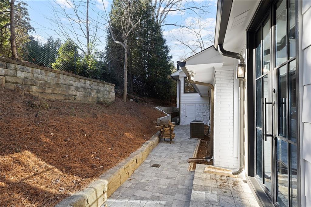 1275 The By Way Northeast Atlanta, GA 30306 - Photo 44 of 48 a backyard of a house with table and chairs