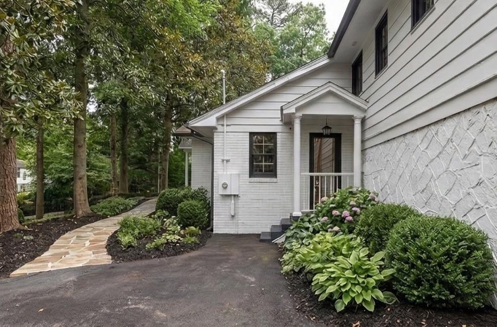 1275 The By Way Northeast Atlanta, GA 30306 - Photo 47 of 48 a view of a house with a yard and potted plants