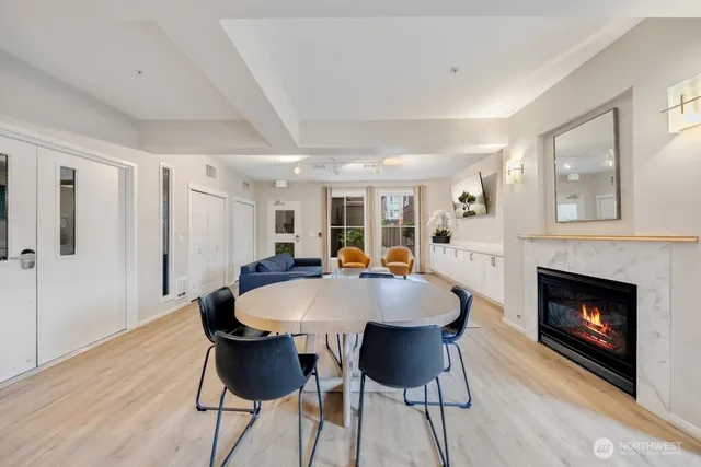 a view of a dining room with furniture and wooden floor