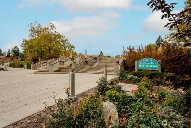 a view of a street with a building in the background