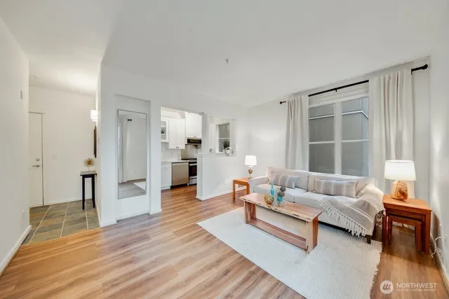 a living room with furniture and a large window