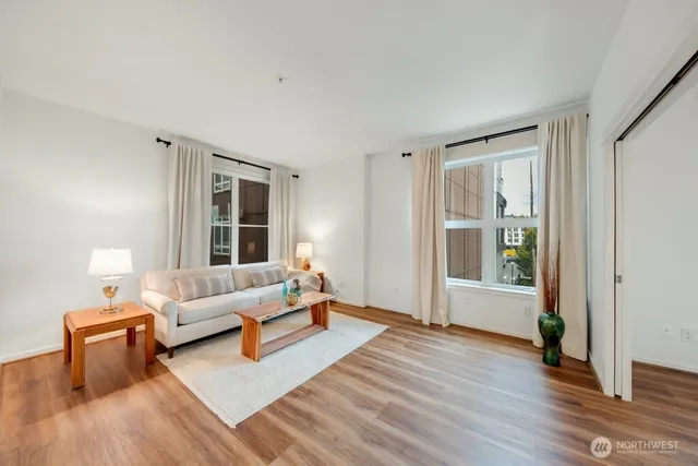 a living room with furniture and a window