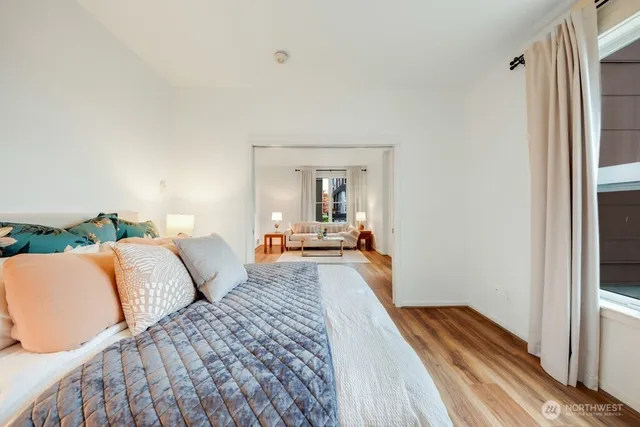 a bedroom with furniture and a mirror