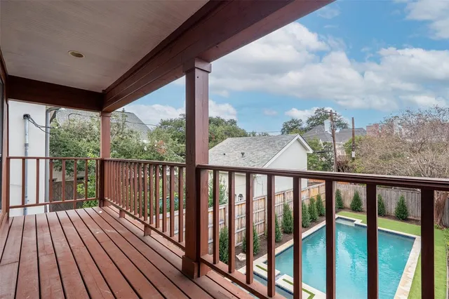 a view of a balcony with wooden floor