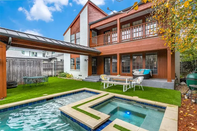 a view of an house with backyard porch and sitting area